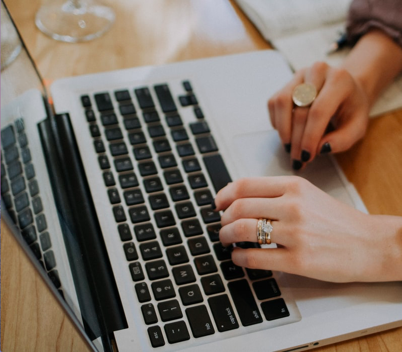 woman typing on computer