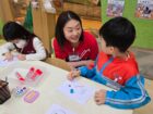 Jeannie Leung reading with a child in Hong Kong