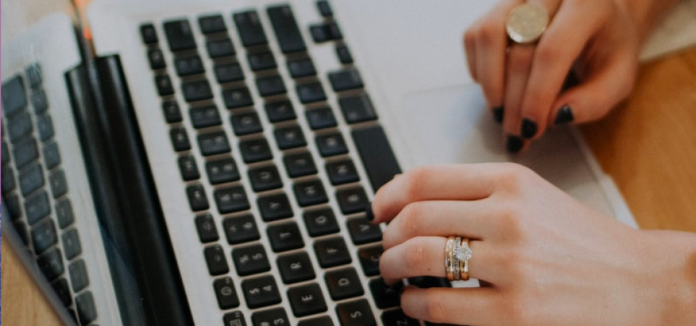 woman typing on computer