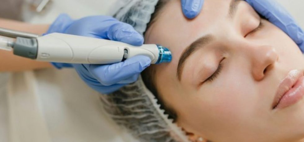 Close-up of a woman receiving a professional skin treatment with a medical-grade facial device at Jolie Beauté clinic